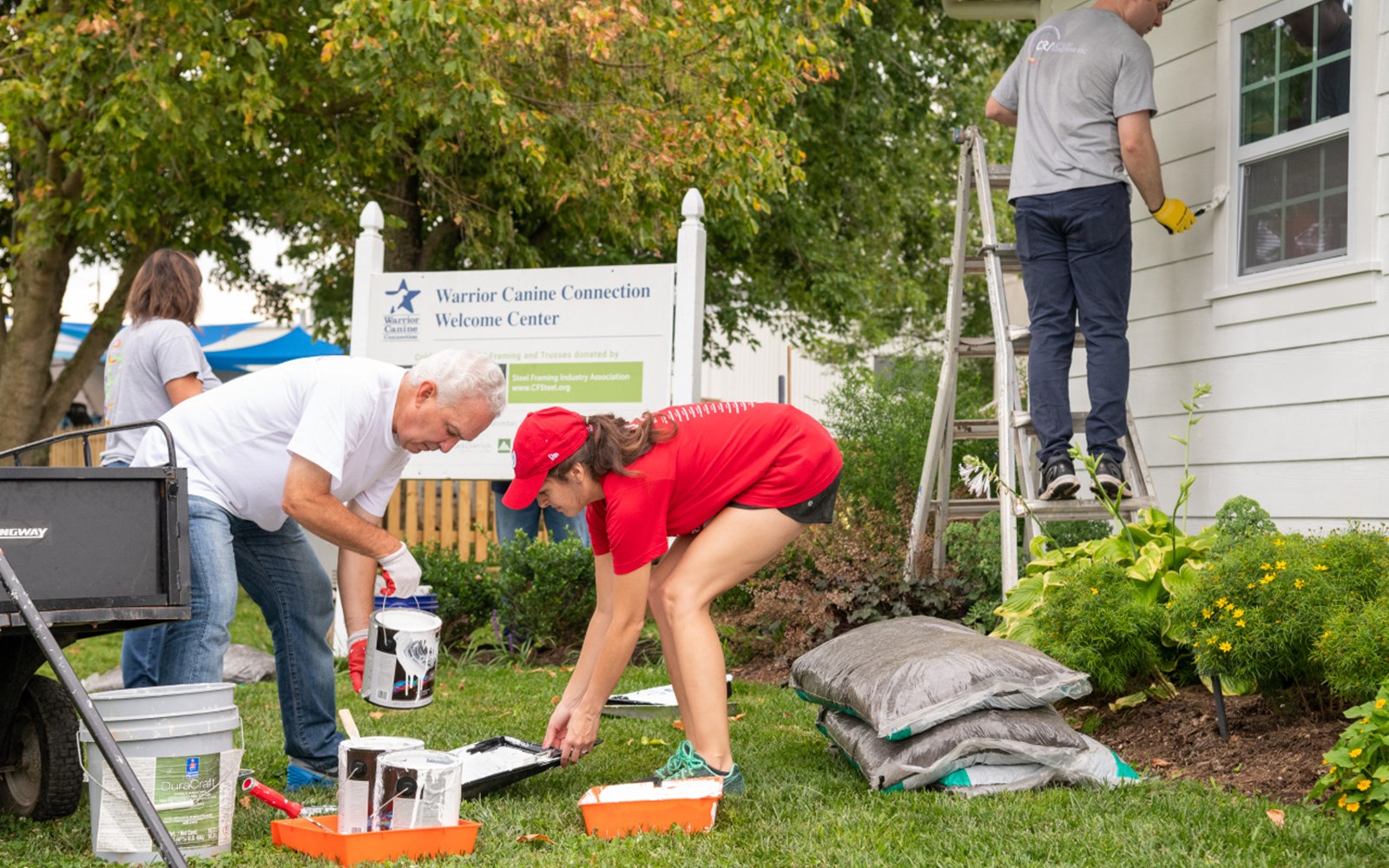 Volunteers painted, helped with some gardening, and played with puppies.