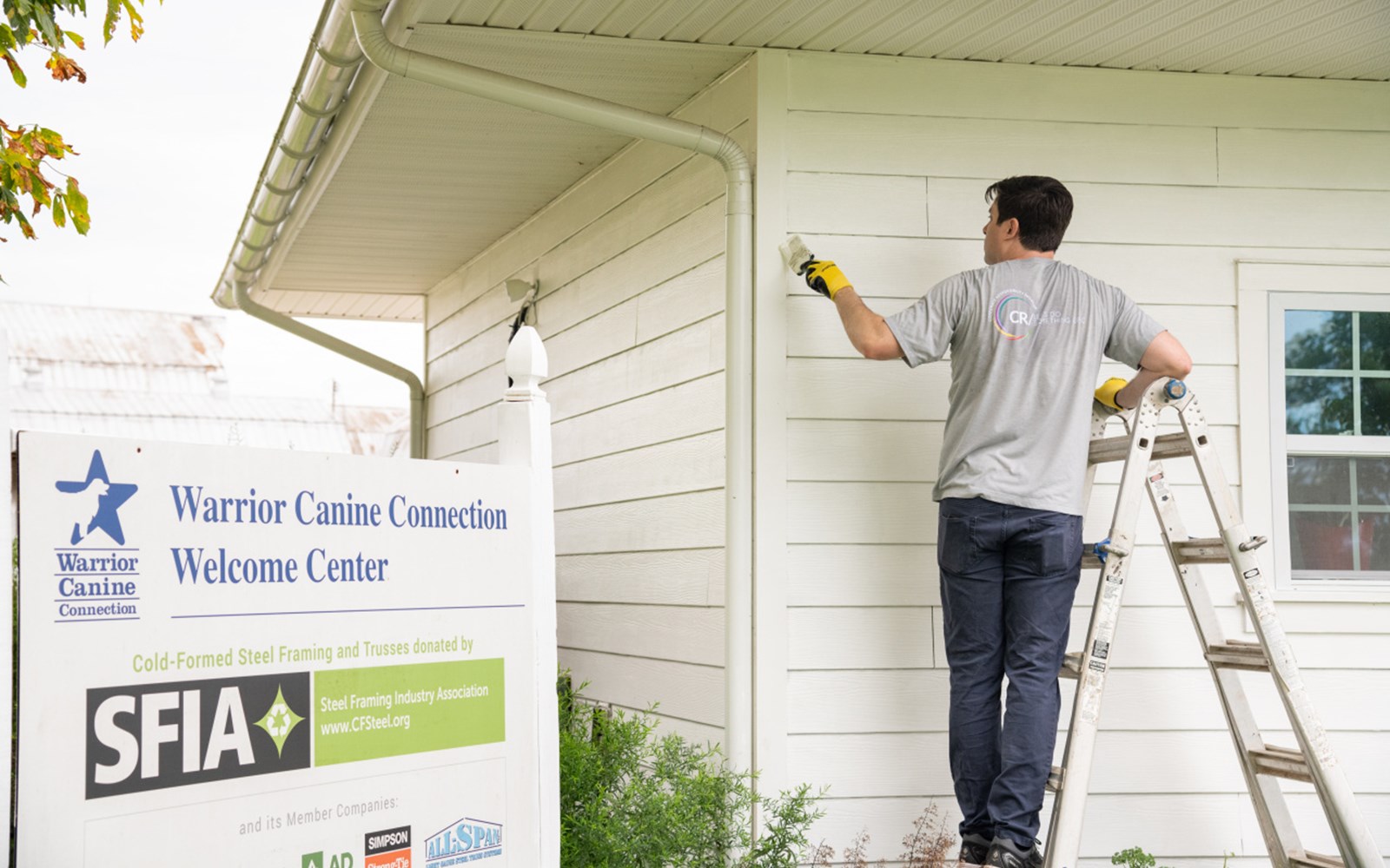 Volunteers painted, helped with some gardening, and played with puppies.