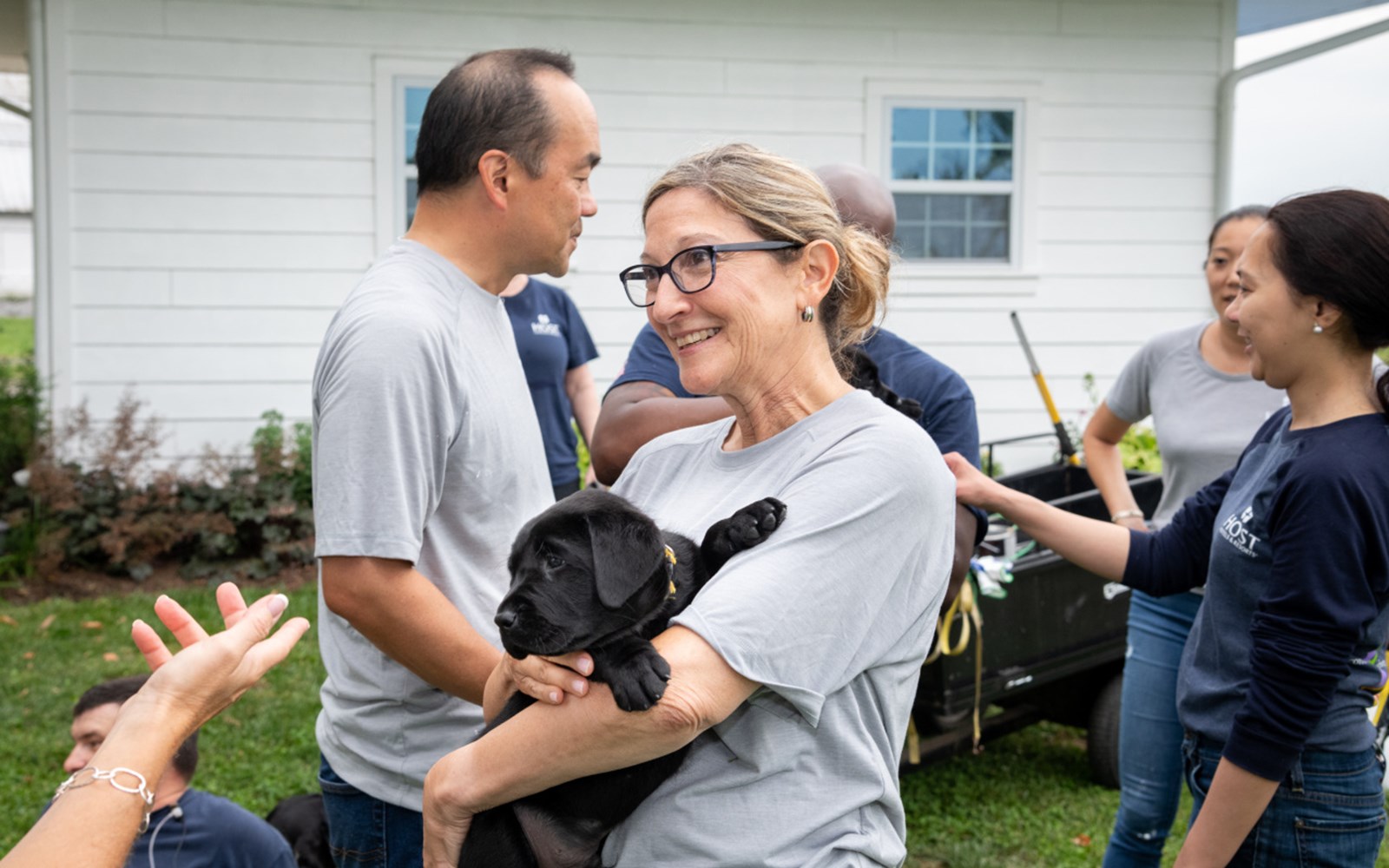 Volunteers painted, helped with some gardening, and played with puppies.