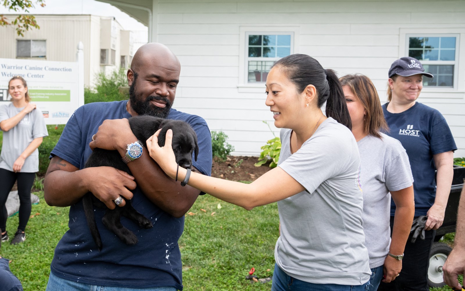 Volunteers painted, helped with some gardening, and played with puppies.