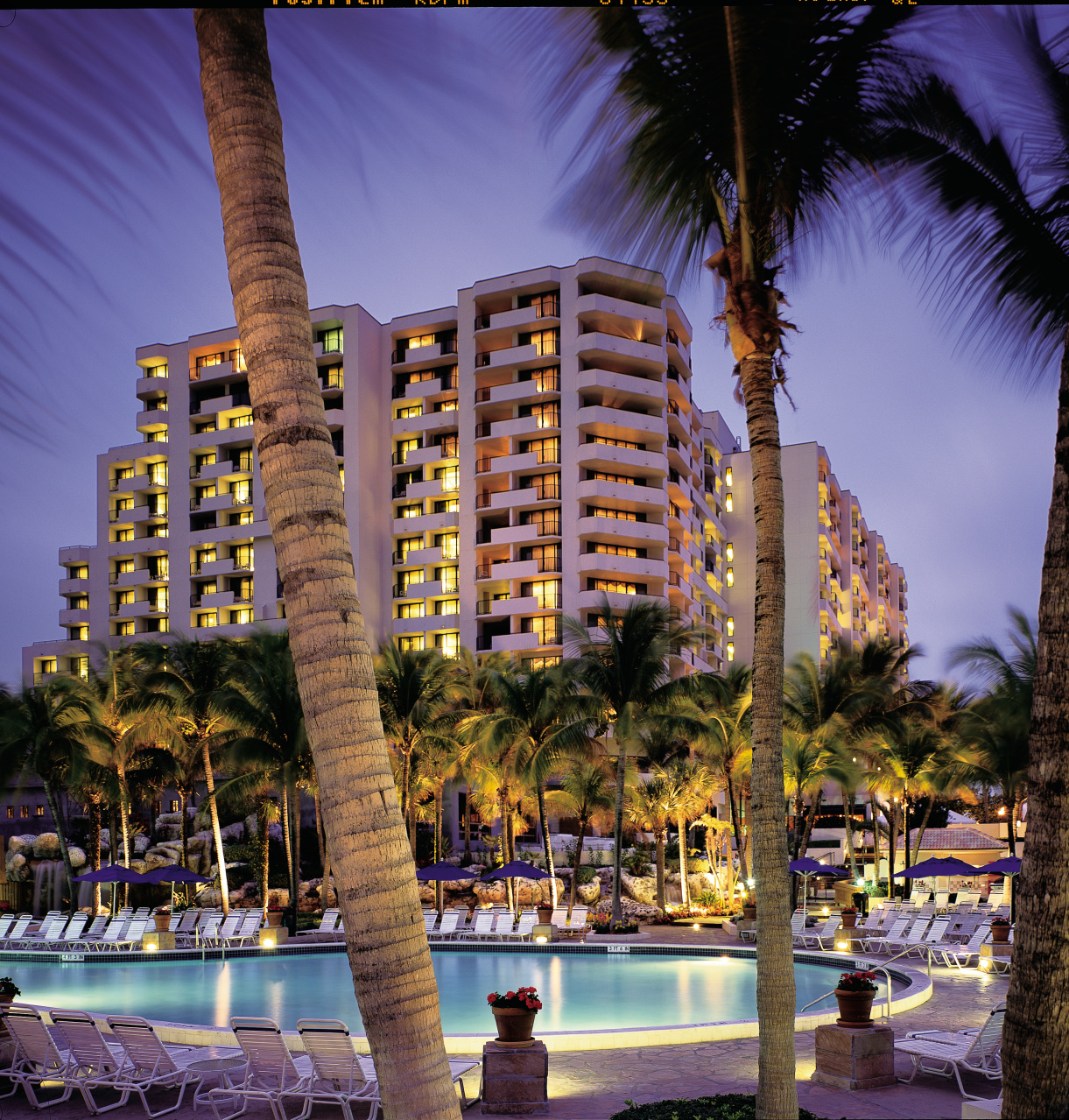 Exterior of pool and building at dusk"Most Commonly Used" property view